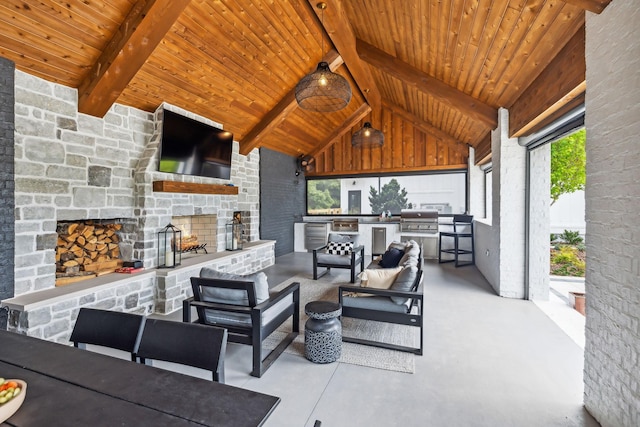 6490 Peytonsville Arno Rd, College Grove, TN 37046 - view of patio / terrace with exterior kitchen, an outdoor living space with a fireplace, and a grill