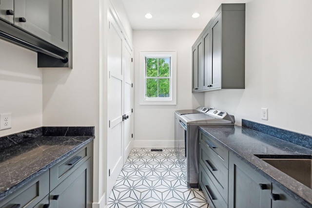 6490 Peytonsville Arno Rd, College Grove, TN 37046 - washroom with a sink, washing machine and dryer, baseboards, cabinet space, and light tile patterned floors