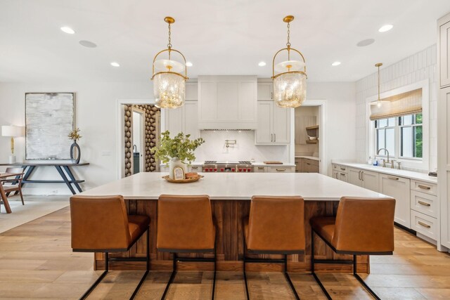 6490 Peytonsville Arno Rd, College Grove, TN 37046 - kitchen featuring a center island, light countertops, recessed lighting, and premium range hood