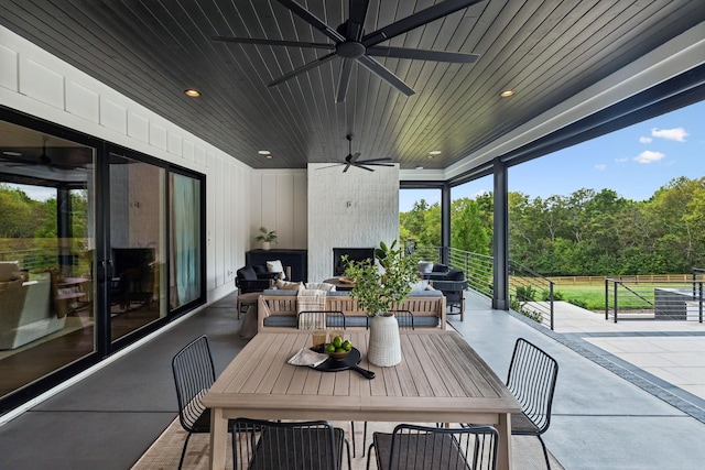 6490 Peytonsville Arno Rd, College Grove, TN 37046 - view of patio with grilling area, a ceiling fan, and a large fireplace