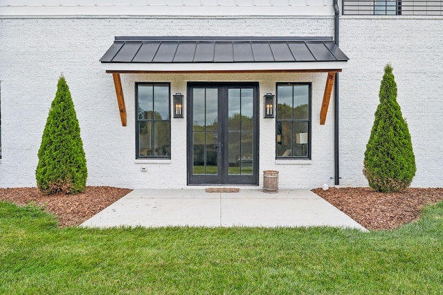 6490 Peytonsville Arno Rd, College Grove, TN 37046 - property entrance featuring a patio area, a lawn, and a standing seam roof