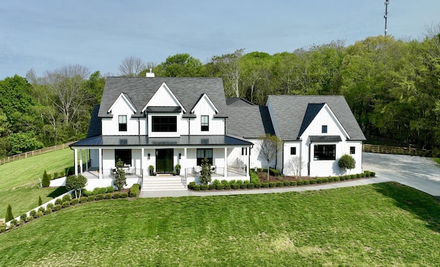 6490 Peytonsville Arno Rd, College Grove, TN 37046 - modern inspired farmhouse featuring a standing seam roof, metal roof, covered porch, board and batten siding, and a front yard