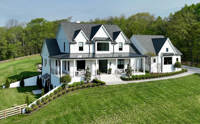 6490 Peytonsville Arno Rd, College Grove, TN 37046 - view of front of house featuring covered porch, a standing seam roof, metal roof, and fence