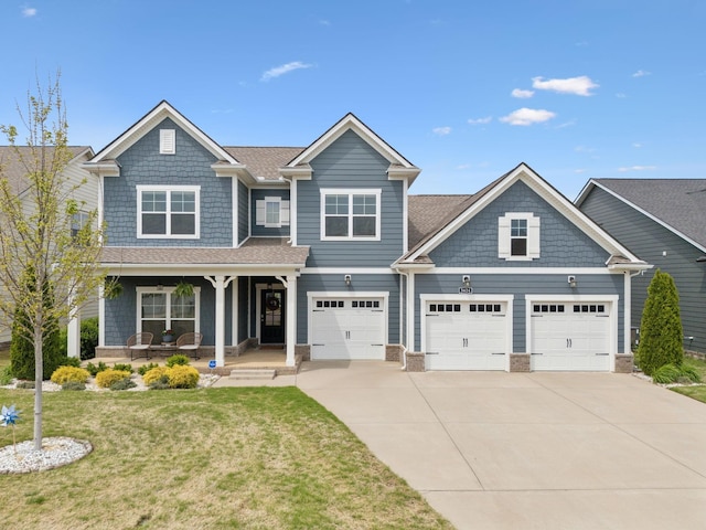 5624 Willoughby Way, Murfreesboro, TN 37129 - craftsman-style home with driveway, covered porch, and a front yard