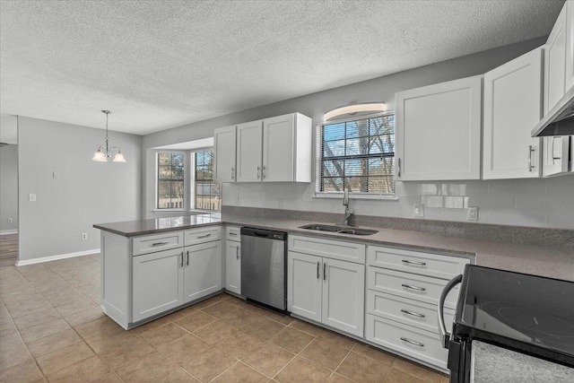 kitchen featuring stainless steel dishwasher, a sink, black electric range, a peninsula, and healthy amount of natural light