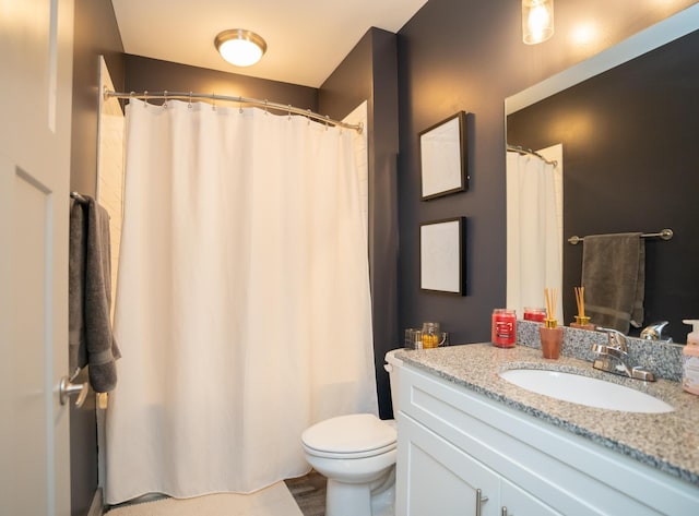 782 Riverfront Pkwy Unit 301, Chattanooga, TN 37402 - bathroom with toilet, vanity, and a shower with curtain