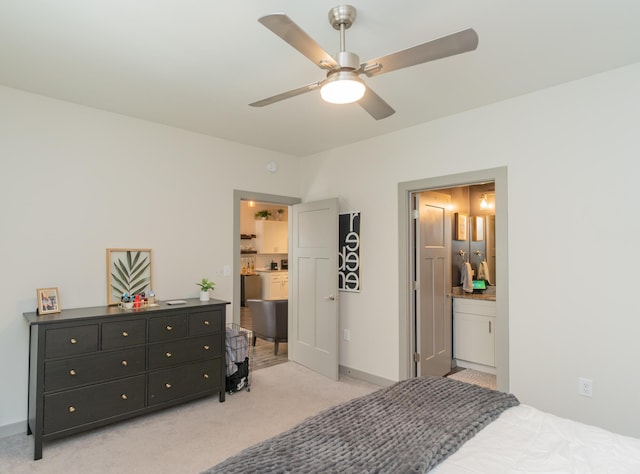 782 Riverfront Pkwy Unit 301, Chattanooga, TN 37402 - bedroom with ensuite bath, a ceiling fan, baseboards, and light carpet