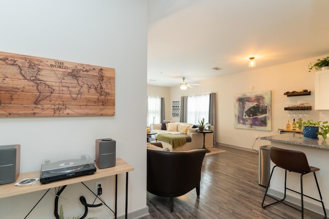 782 Riverfront Pkwy Unit 301, Chattanooga, TN 37402 - living room featuring dark wood-type flooring, a ceiling fan, and baseboards
