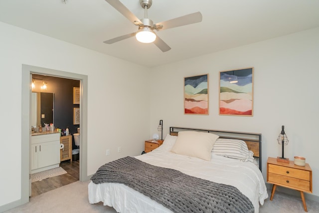 782 Riverfront Pkwy Unit 301, Chattanooga, TN 37402 - carpeted bedroom with connected bathroom, baseboards, a ceiling fan, and a sink