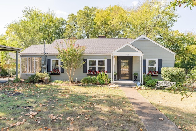 314 Williams Dr, Chattanooga, TN 37421 - ranch-style home featuring a chimney, roof with shingles, a sunroom, and a front yard