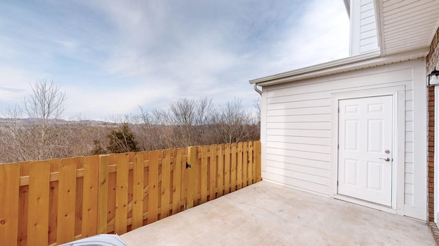 view of patio / terrace featuring fence