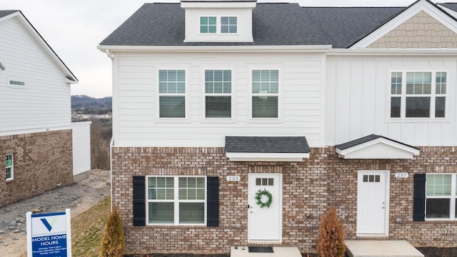 view of front of home with a shingled roof