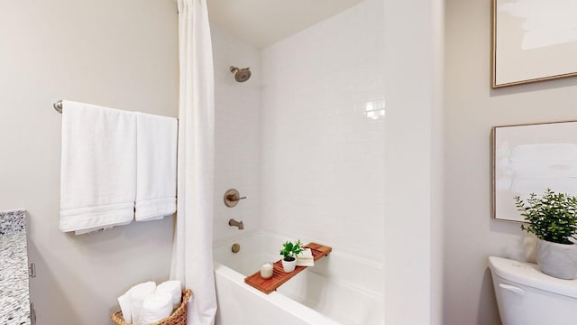 bathroom with shower / bathtub combination with curtain and toilet