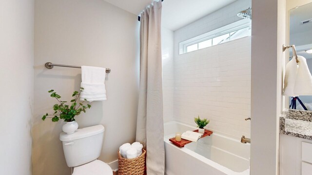 full bath featuring shower / tub combo, toilet, and vanity