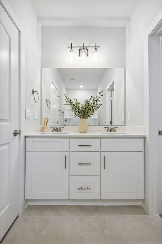 541 Tulip Springs Rd, Hermitage, TN 37076 - full bath with tile patterned floors, visible vents, a sink, and double vanity