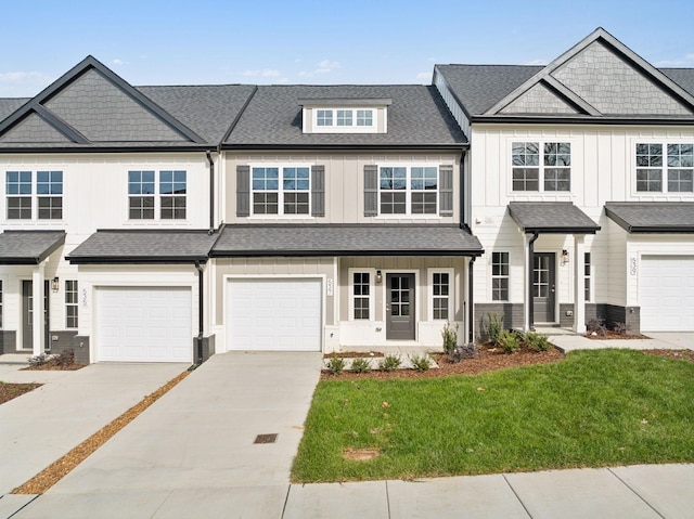 541 Tulip Springs Rd, Hermitage, TN 37076 - townhome / multi-family property featuring a front lawn, driveway, board and batten siding, an attached garage, and roof with shingles