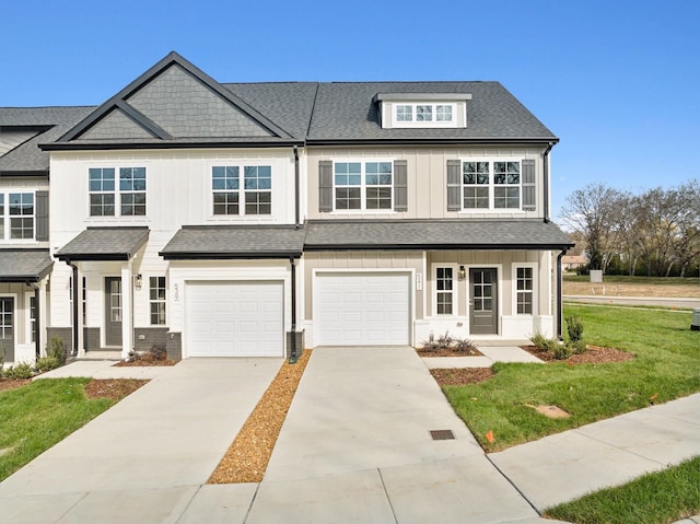 541 Tulip Springs Rd, Hermitage, TN 37076 - townhome / multi-family property featuring board and batten siding, a shingled roof, a front yard, and concrete driveway