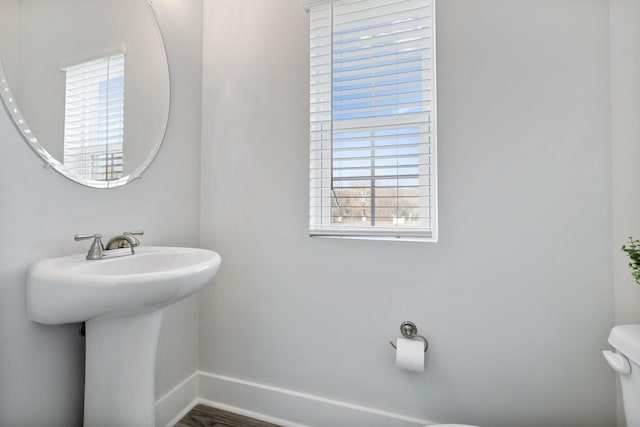 541 Tulip Springs Rd, Hermitage, TN 37076 - bathroom featuring toilet, baseboards, and a sink