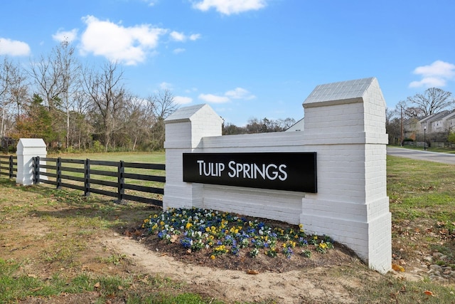 community sign with fence