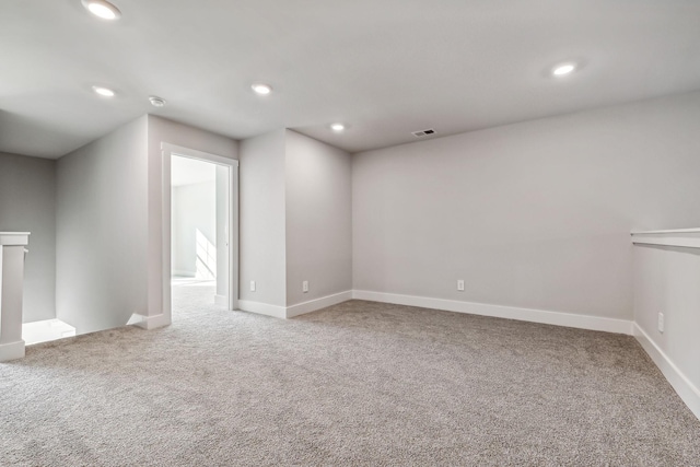 unfurnished room featuring baseboards, carpet flooring, and recessed lighting