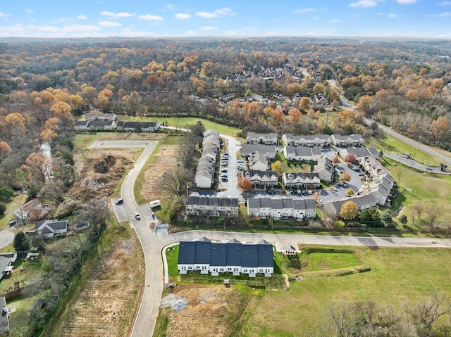 drone / aerial view featuring a view of trees