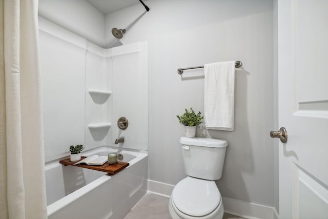 full bath with shower / bath combo, baseboards, toilet, and tile patterned flooring