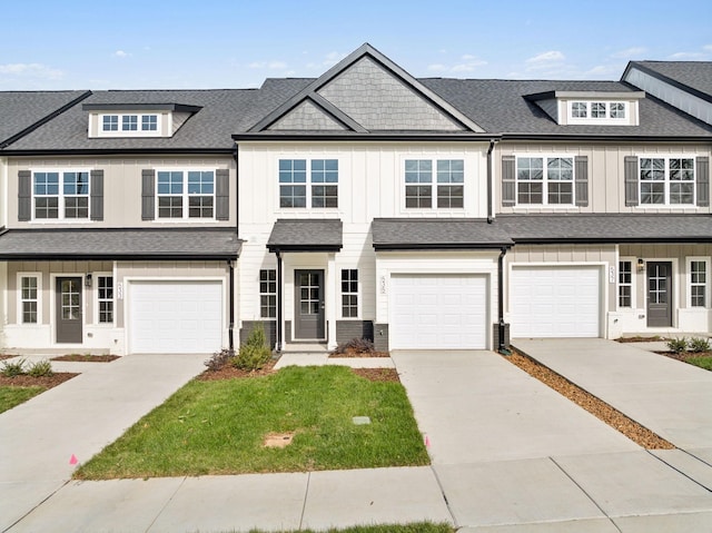 multi unit property with a garage, driveway, and a shingled roof