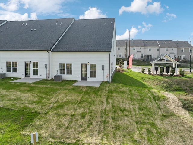 back of property featuring cooling unit, a gazebo, a residential view, and a patio