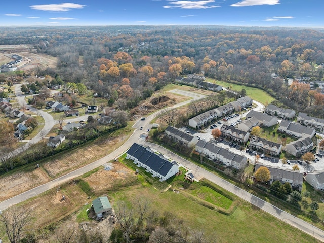 bird's eye view featuring a forest view