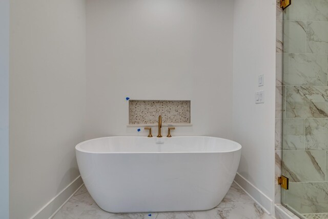 118 Shadow Springs Dr Unit 118, Brentwood, TN 37027 - full bathroom featuring a shower stall, a freestanding tub, marble finish floor, and baseboards