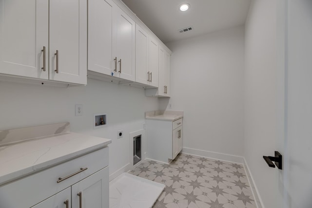 118 Shadow Springs Dr Unit 118, Brentwood, TN 37027 - washroom featuring hookup for a washing machine, hookup for an electric dryer, light floors, cabinet space, and visible vents