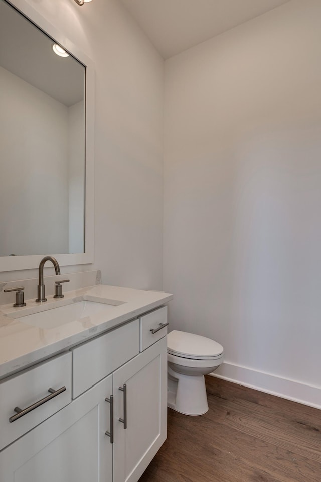 118 Shadow Springs Dr Unit 118, Brentwood, TN 37027 - bathroom with baseboards, wood finished floors, vanity, and toilet