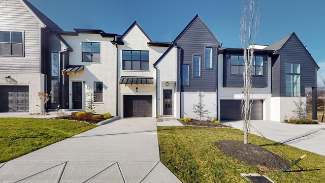 108 Shadow Springs Dr Unit 108, Brentwood, TN 37027 - view of front facade featuring an attached garage, driveway, and brick siding