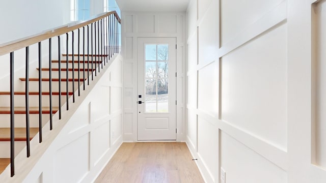 108 Shadow Springs Dr Unit 108, Brentwood, TN 37027 - doorway with a decorative wall, stairs, and light wood finished floors