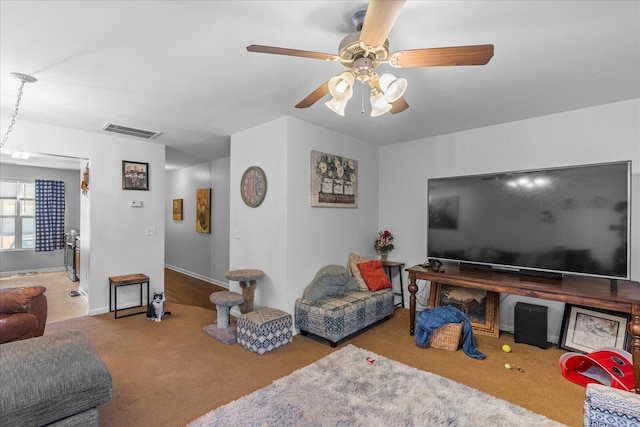 9051 Haileys Pond Dr, Ooltewah, TN 37363 - carpeted living area with baseboards, a ceiling fan, and visible vents
