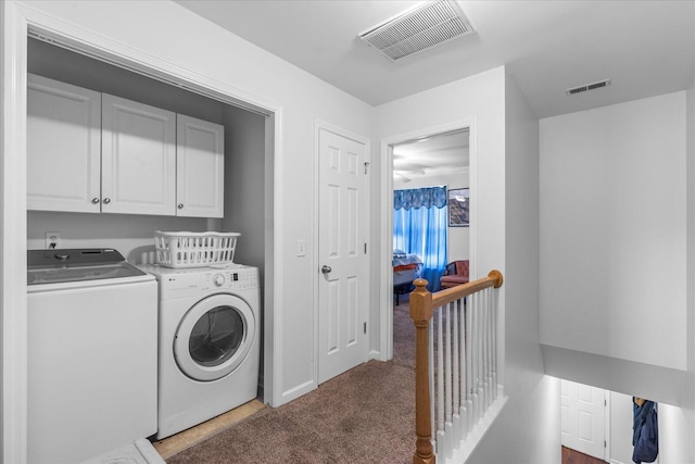 9051 Haileys Pond Dr, Ooltewah, TN 37363 - clothes washing area with cabinet space, carpet flooring, visible vents, and independent washer and dryer