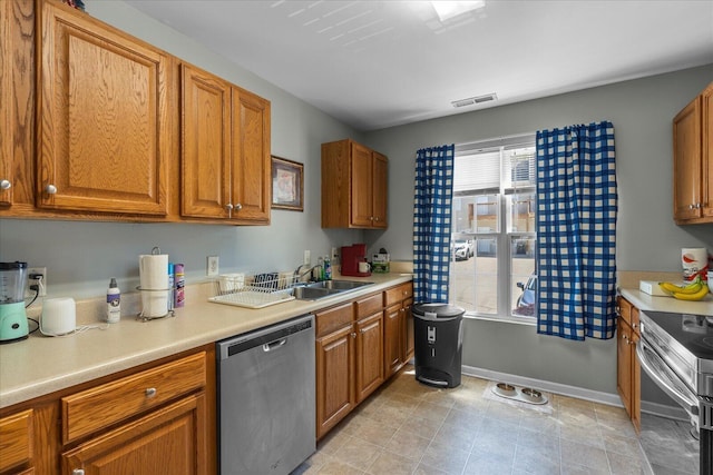9051 Haileys Pond Dr, Ooltewah, TN 37363 - kitchen with light countertops, a healthy amount of sunlight, stainless steel appliances, and a sink