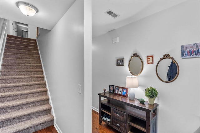 9051 Haileys Pond Dr, Ooltewah, TN 37363 - stairs featuring baseboards, wood finished floors, and visible vents
