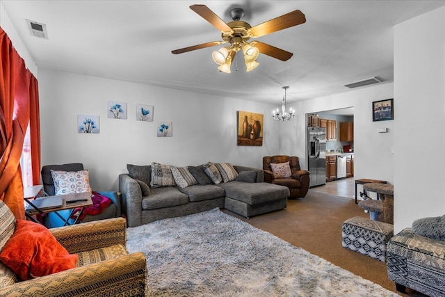 9051 Haileys Pond Dr, Ooltewah, TN 37363 - living room featuring carpet flooring, visible vents, and ceiling fan with notable chandelier