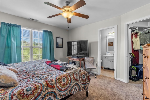 9051 Haileys Pond Dr, Ooltewah, TN 37363 - carpeted bedroom with a ceiling fan, ensuite bathroom, a walk in closet, baseboards, and visible vents