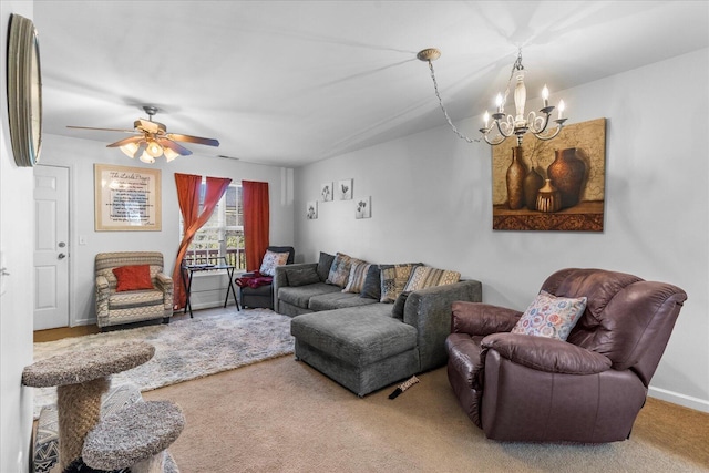 9051 Haileys Pond Dr, Ooltewah, TN 37363 - living area featuring carpet flooring and ceiling fan with notable chandelier