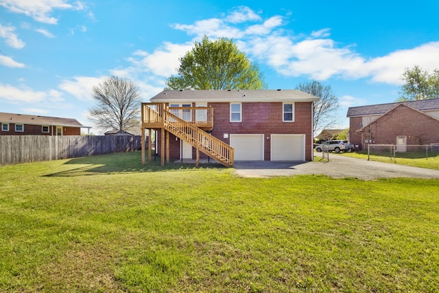 302 Windrush Dr, Clarksville, TN 37042 - rear view of house with driveway, fence, a garage, stairway, and a deck