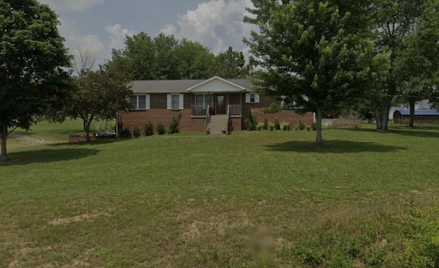 single story home featuring a front lawn and brick siding