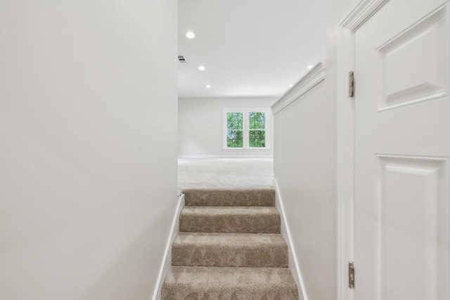 stairway with recessed lighting, baseboards, visible vents, and carpet
