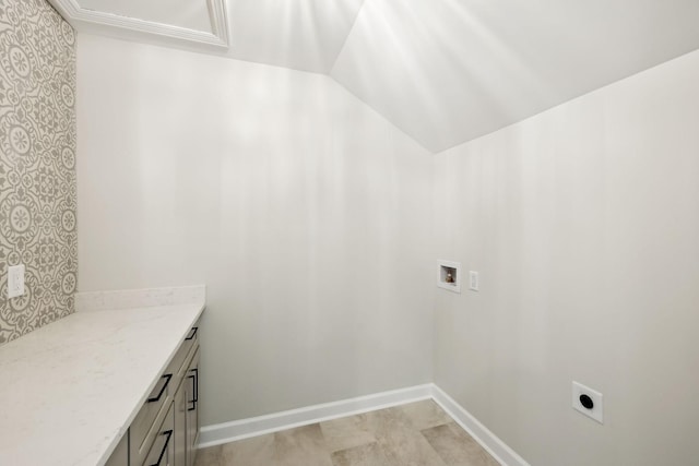 washroom featuring electric dryer hookup, hookup for a washing machine, and cabinet space