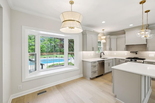 kitchen featuring visible vents, a sink, gray cabinets, and appliances with stainless steel finishes