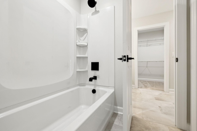 full bathroom featuring  shower combination, baseboards, and marble finish floor