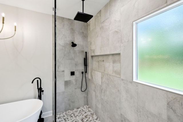 full bath with tiled shower and a soaking tub