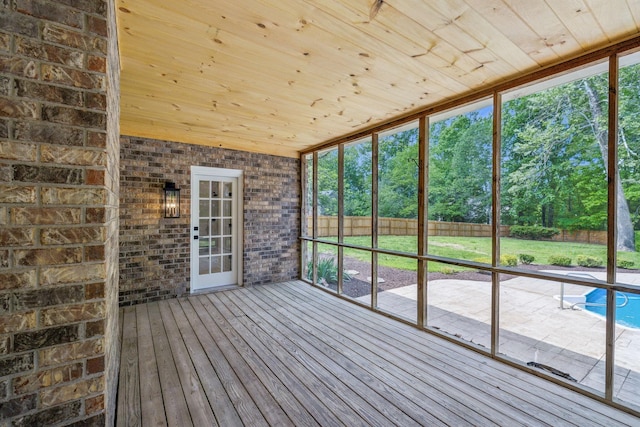 unfurnished sunroom featuring a wealth of natural light