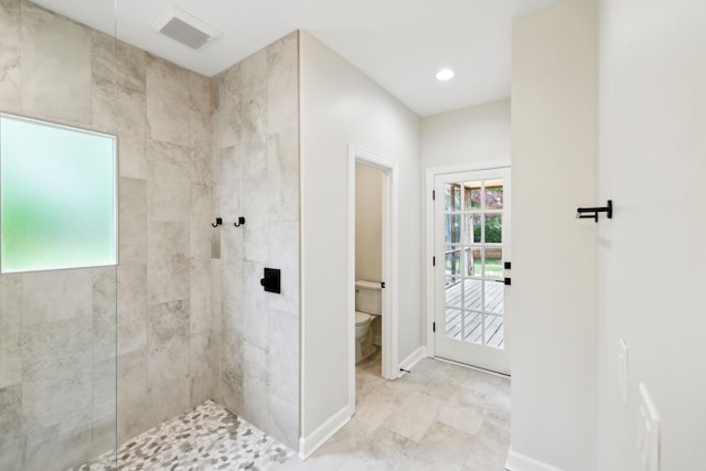 bathroom with visible vents, toilet, baseboards, recessed lighting, and a walk in shower